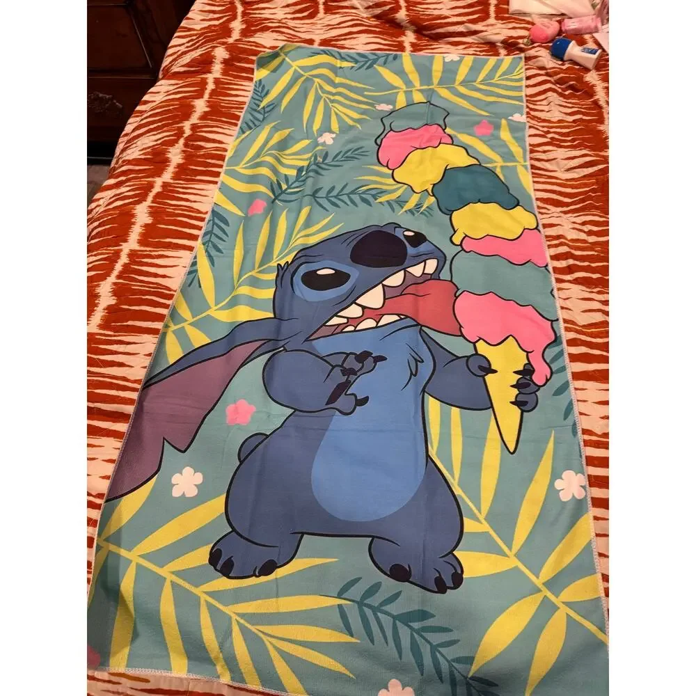 Stitch beach towel with Stitch holding a multi-colored ice cream palm leaves